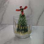 vela en frasco con pino